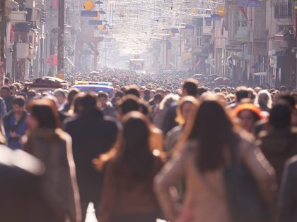 people crowd walking on busy street on daytime; Shutterstock ID 290124470